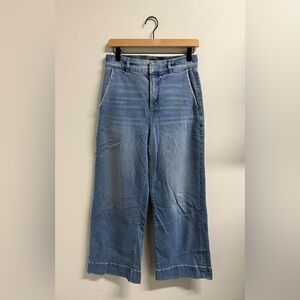 Ann Taylor blue denim wide leg trouser jeans with a relaxed fit.